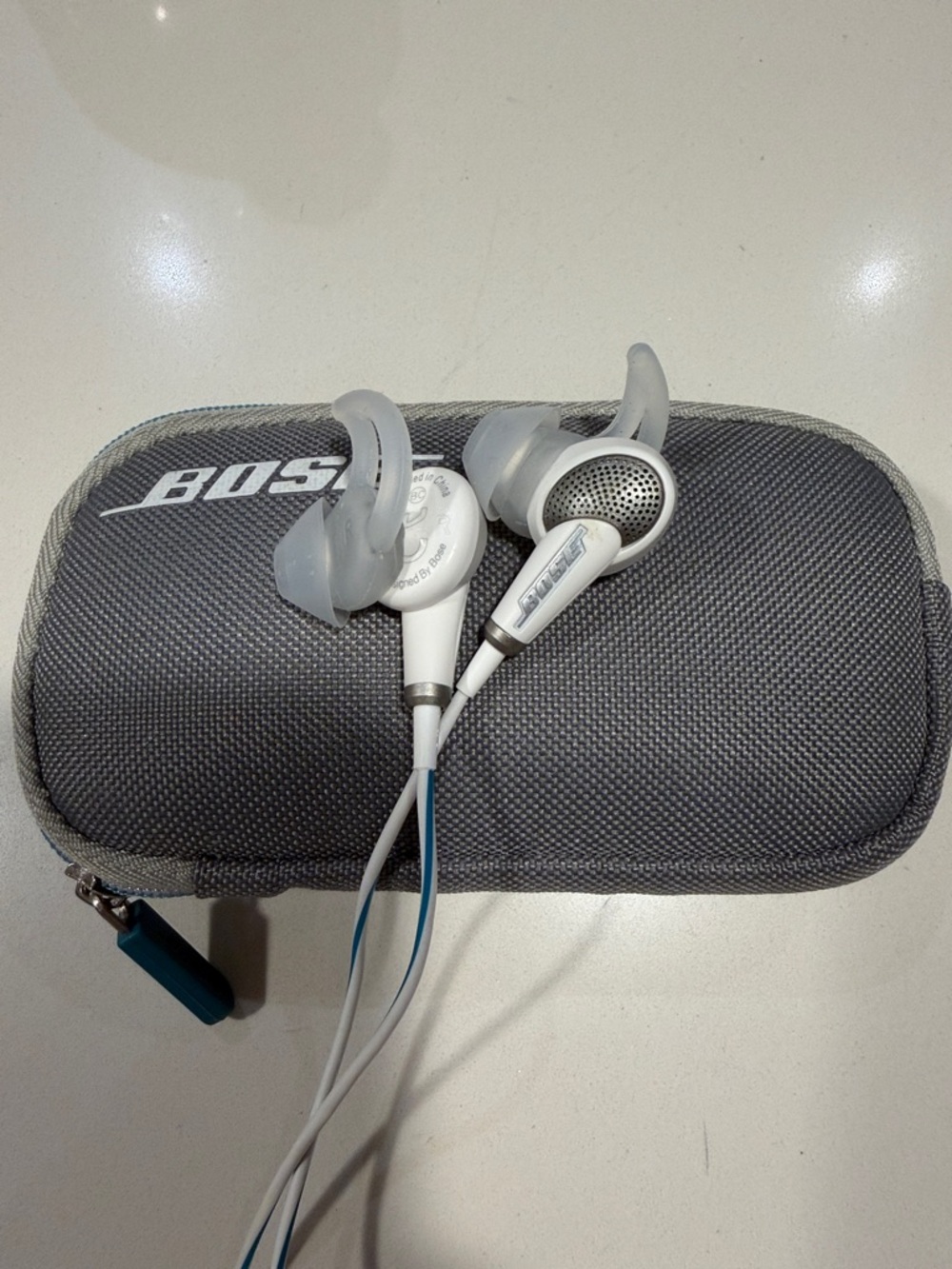 Bose White Earbuds with Light Blue Accents and Gray Zip Case - Picture 3 of 4